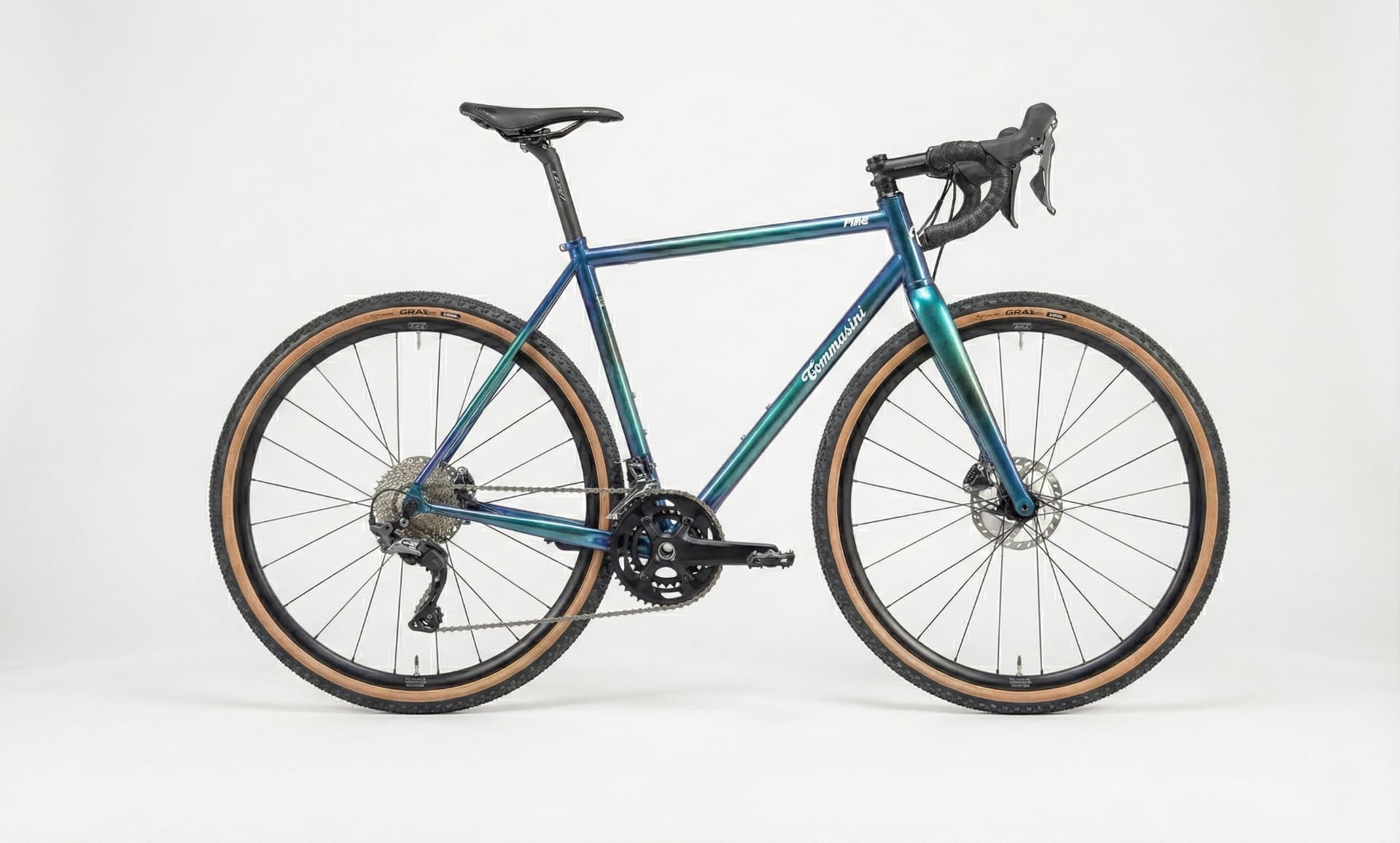 Tommasini Fire Argentario Special Edition gravel bike in blue-to-green iridescent finish, studio shot