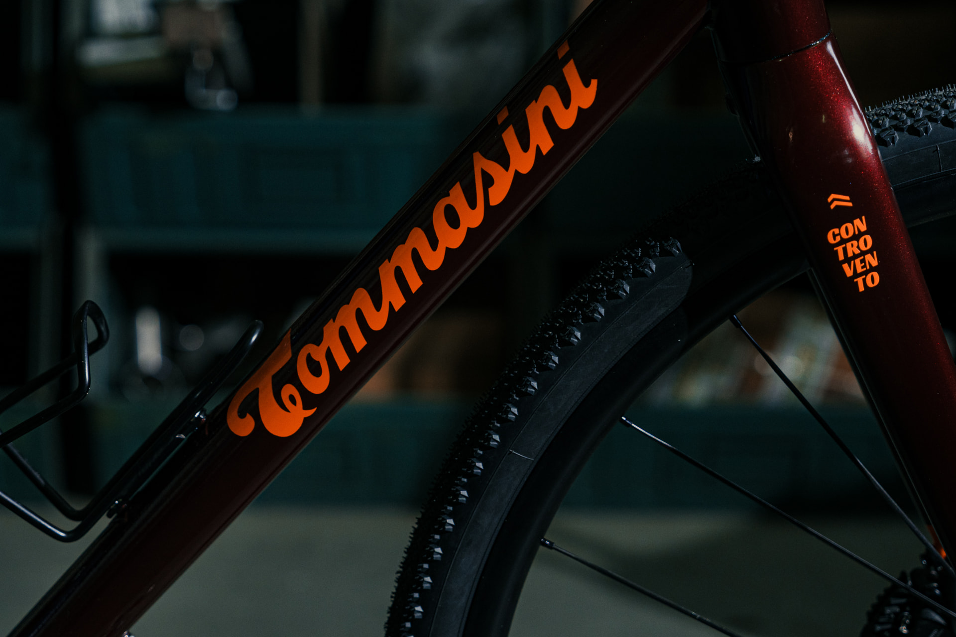 Orange Tommasini script on the burgundy Impanga down tube with the vertical Controvento lettering on the head tube